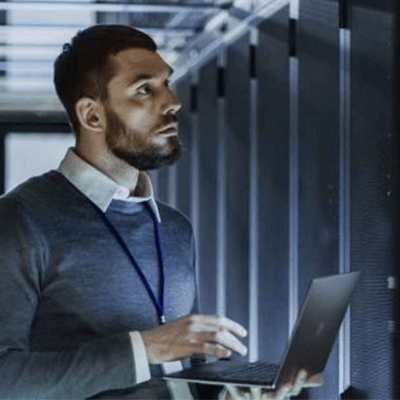 Man in a datacenter. Systems engineer.